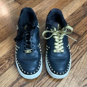 Nike. Air Force ones. Size 8 (women’s) Black and gold.